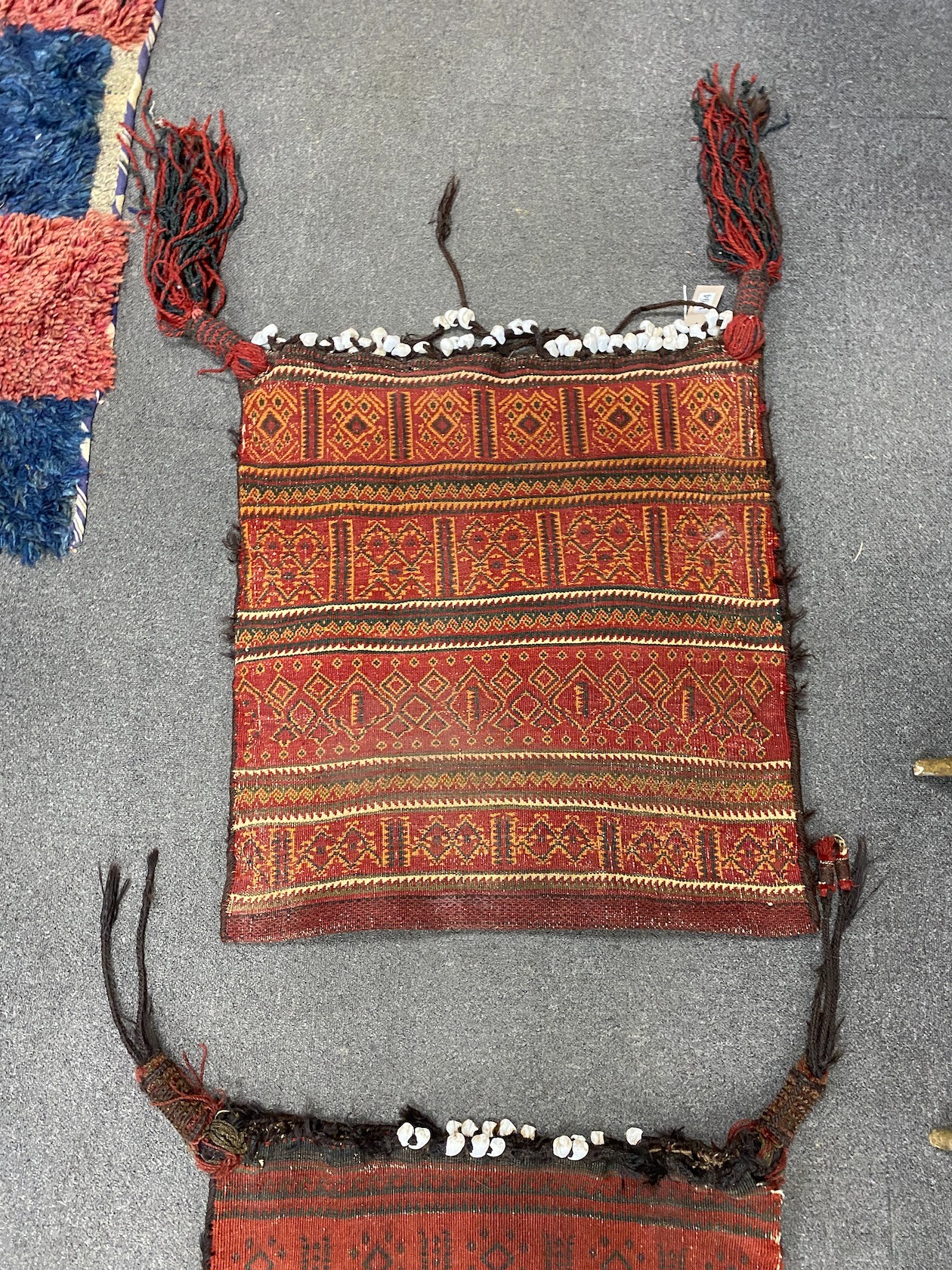 Two Afghan polychrome salt bags, larger 84cm x 48cm.